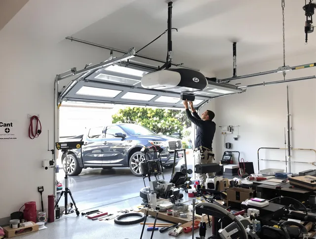 North Olmsted Garage Door Repair specialist installing smart garage door opener system in North Olmsted home