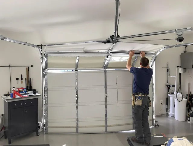 North Olmsted Garage Door Repair specialist performing precise section replacement on North Olmsted garage door